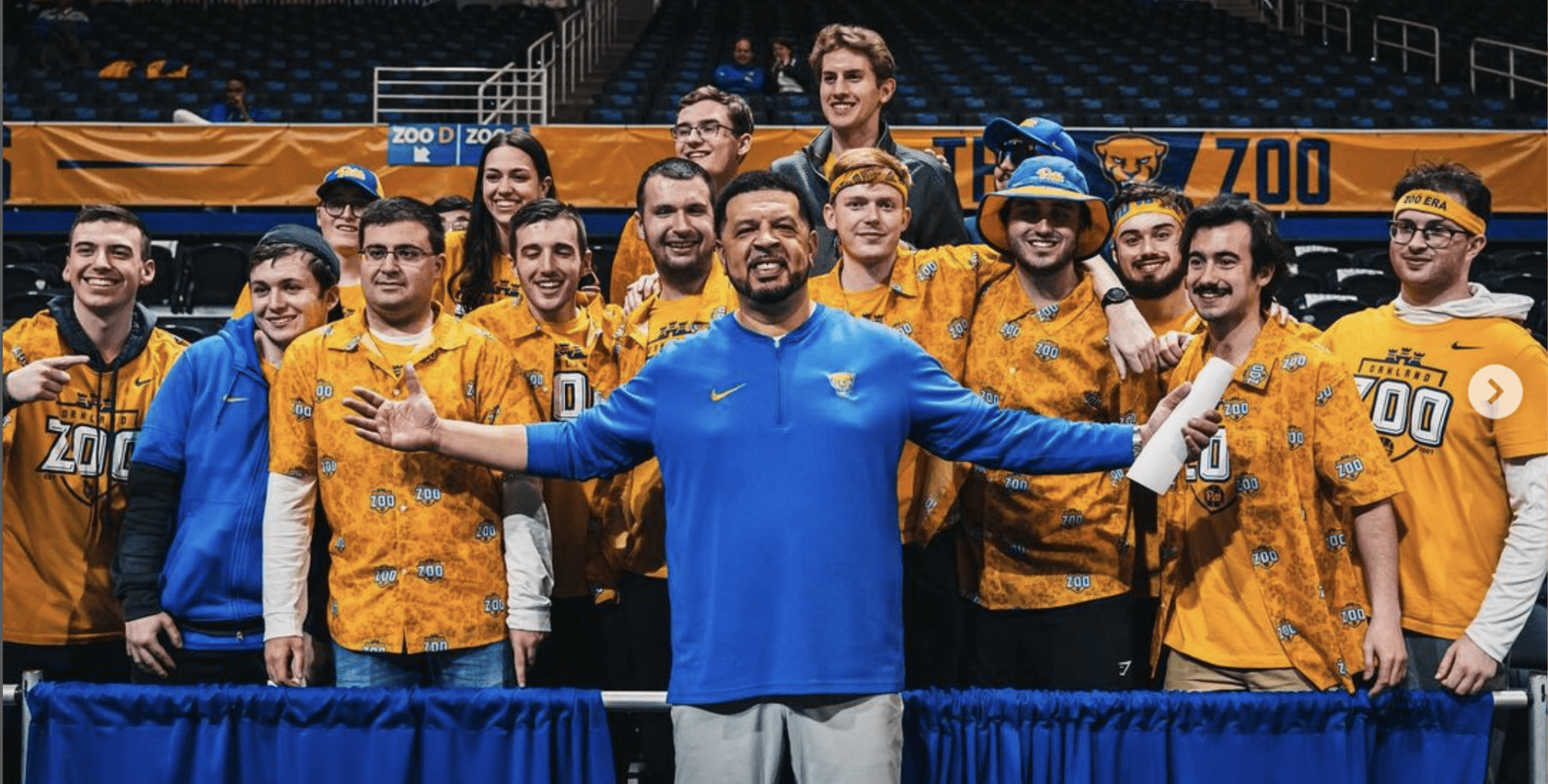 Pitt head coach Jeff Capel with members of the "Oakland Zoo," Pitt's student section.